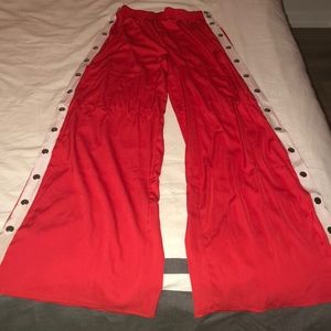 Red flair pants with snap buttons on the side